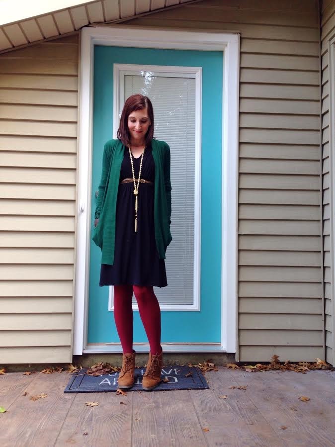 green loose cardigan + black dress + tassel necklace + burgundy tights + camel colored booties