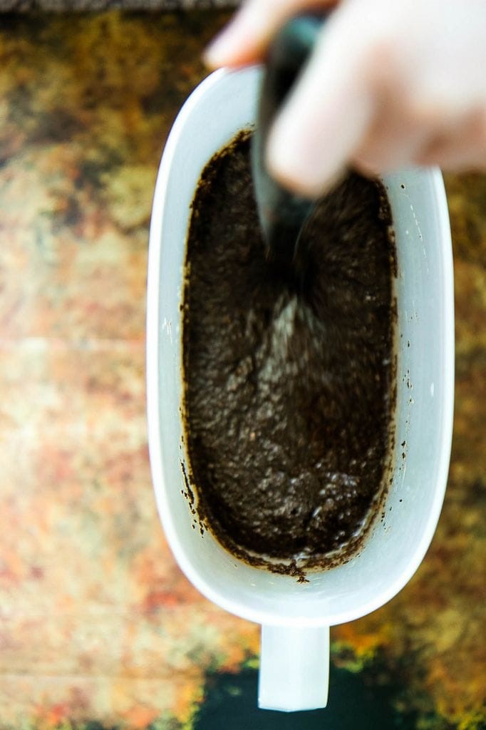 mixing the coffee grounds with water
