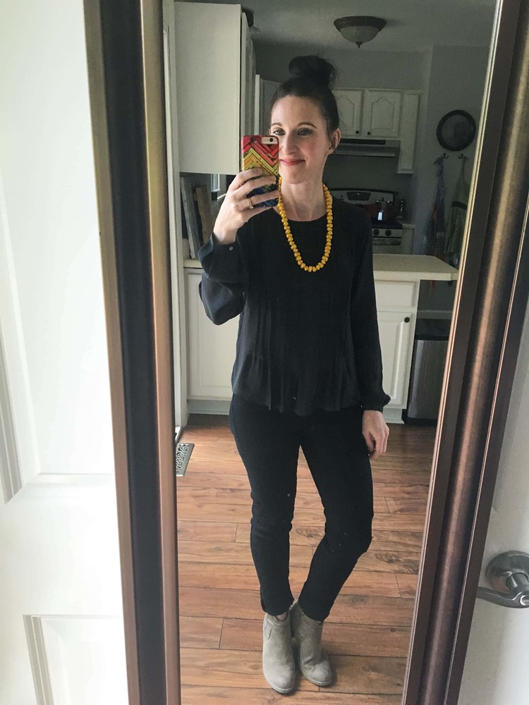 All black, mustard necklace, & suede booties